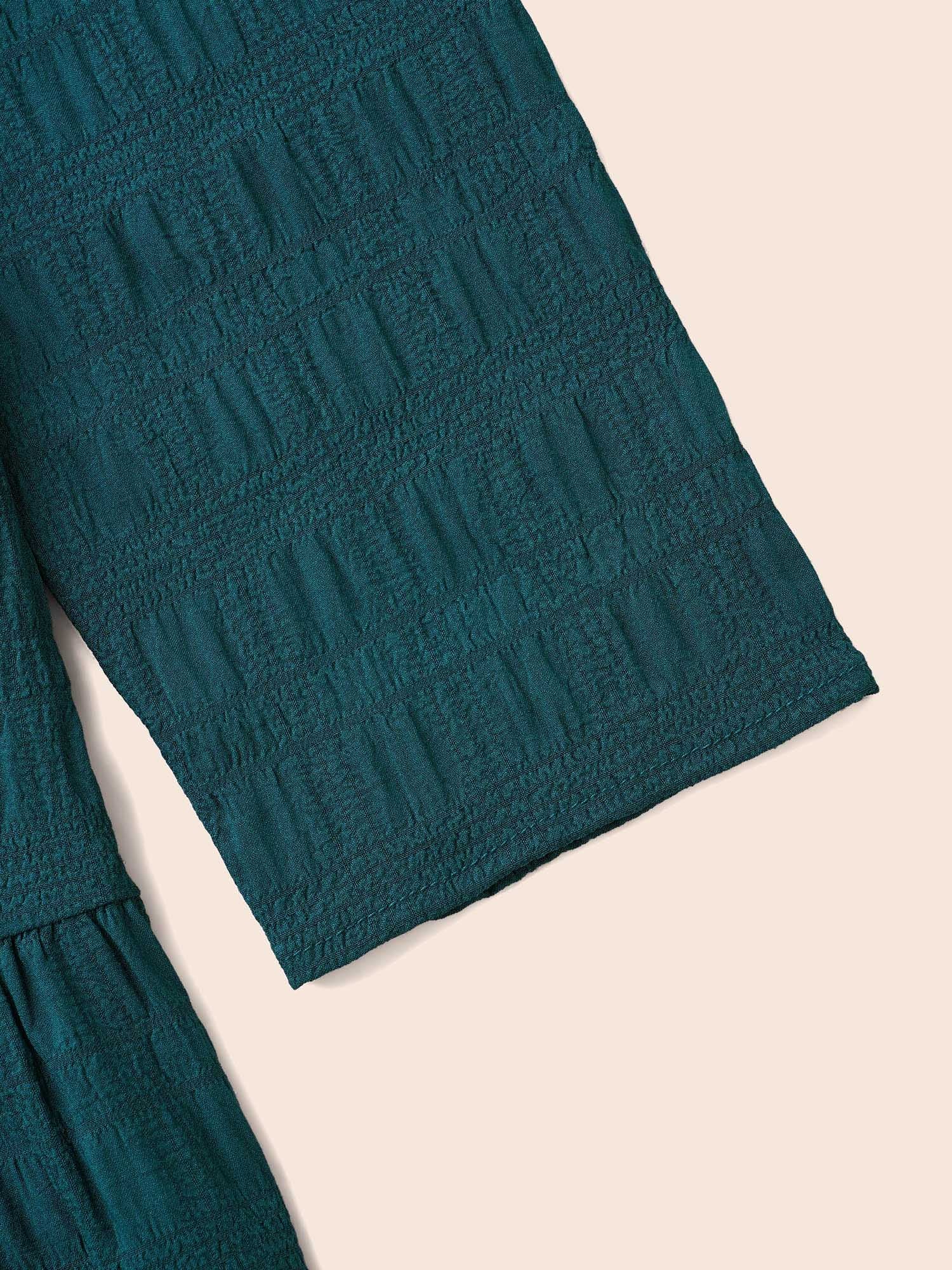 Textured Round Neck Tiered Hem Blouse