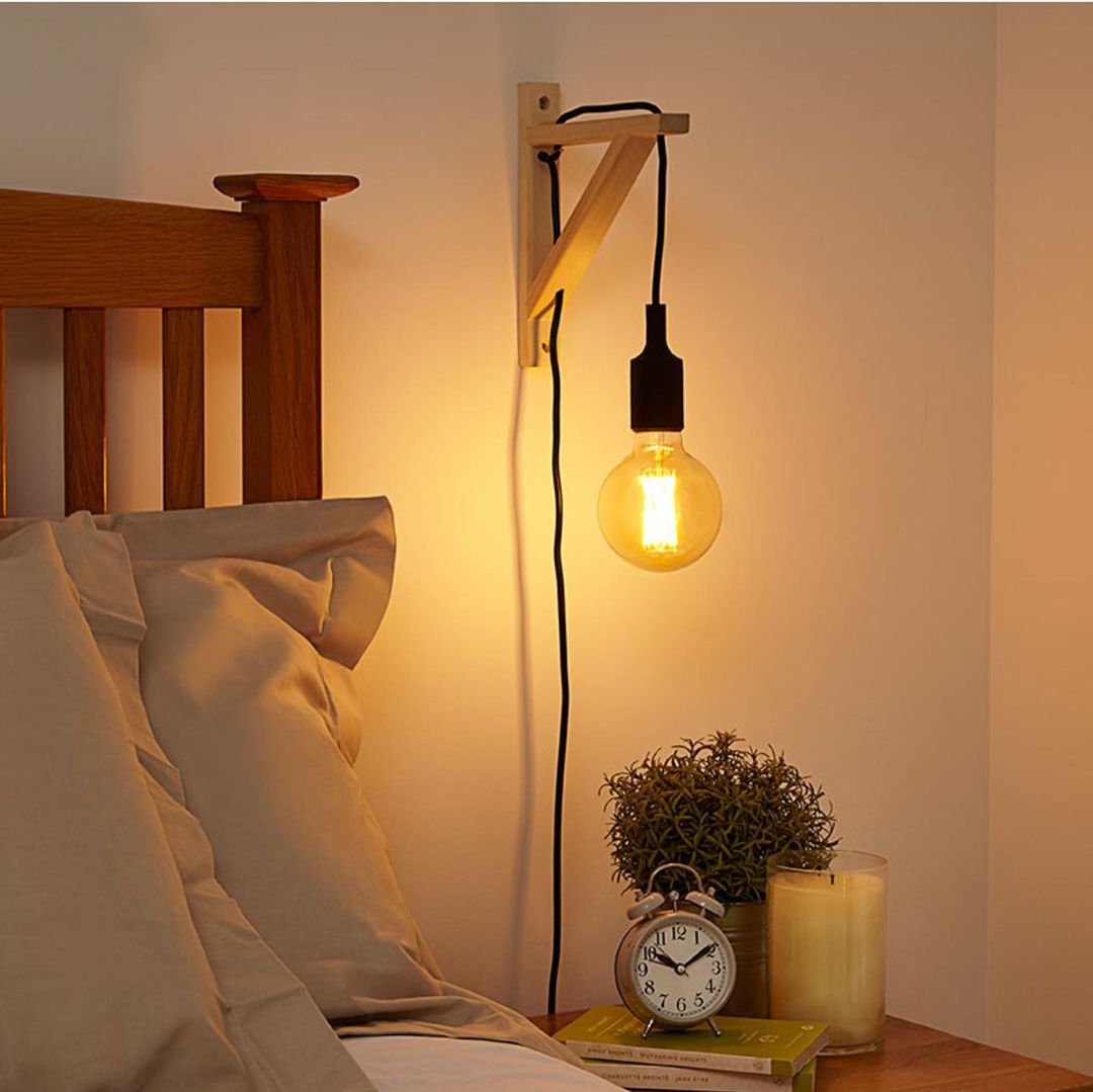Minimalist Wall-Mounted Bedside Light with Exposed Bulb
