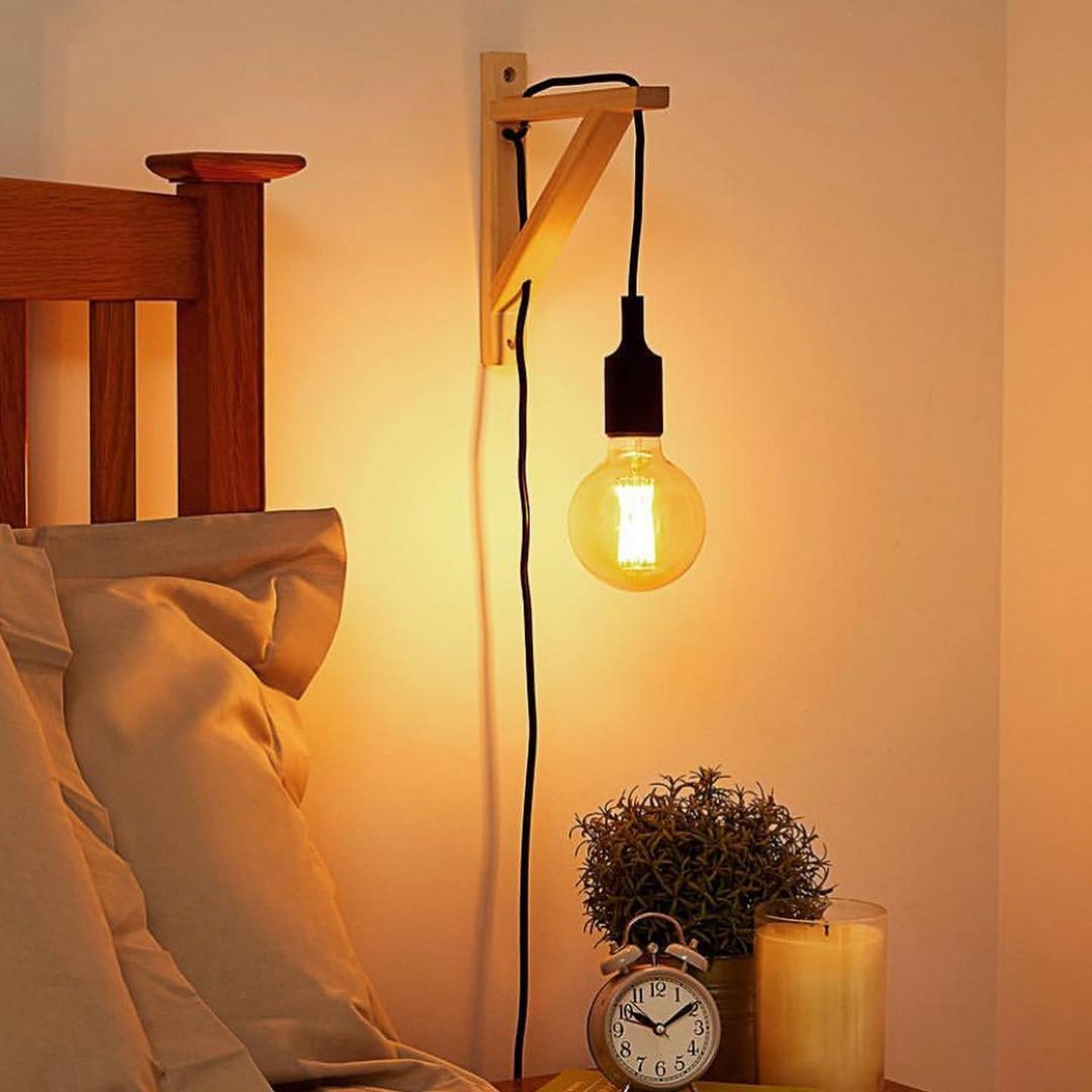 Minimalist Wall-Mounted Bedside Light with Exposed Bulb